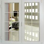 Double-opening casement window with grille-