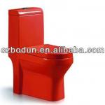 floor mounted red colored water closet
