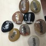 engraved stone, pebble stone with letter