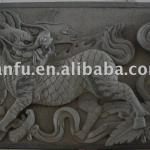 Carved stone animal wall decoration
