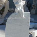 white marble headstone and monument